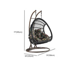 Tropical upholstered porch swing with metal chain and included stand for outdoor relaxation