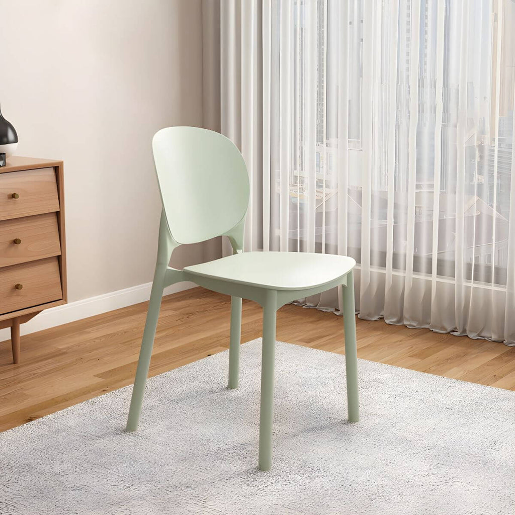 Stackable Scandinavian side chair with open back made of plastic and acrylic for dining