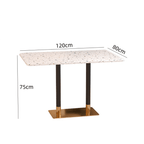 Rattan dining chairs with durable terrazzo table for an elegant dining setup