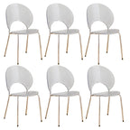 Stackable acrylic dining chair with open back and metal legs, armless design for modern dining rooms