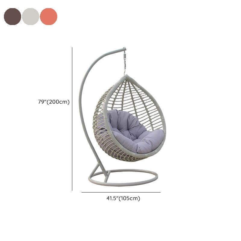 Metal porch swing with stand, cushions, and chain for comfortable outdoor seating