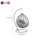 Metal porch swing with stand, cushions, and chain for comfortable outdoor seating