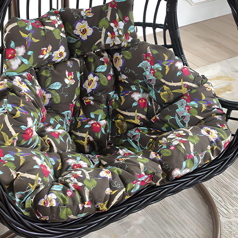 Tropical upholstered porch swing with metal chain and included stand for outdoor relaxation