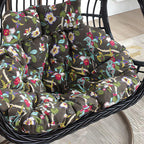 Tropical upholstered porch swing with metal chain and included stand for outdoor relaxation