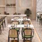 Rattan dining chairs with durable terrazzo table for an elegant dining setup