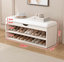 Modern white and orange shoe bench with upholstered seat and space-saving storage