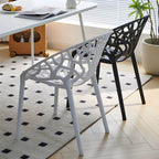 Scandinavian style sloped arm chair made of plastic and acrylic, ideal for kitchen and dining areas