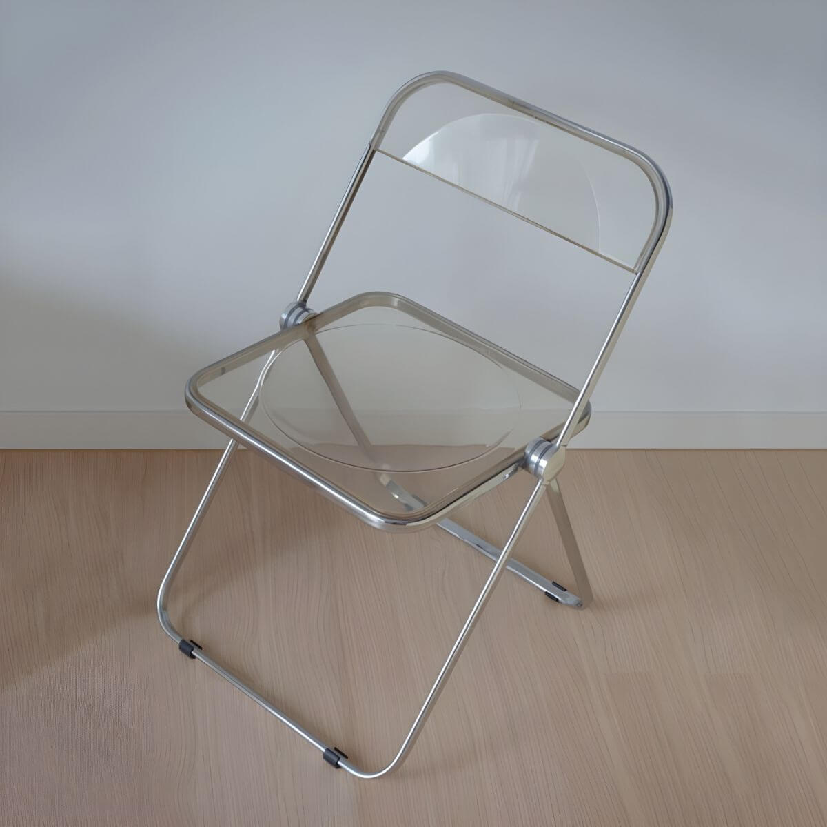 Contemporary acrylic folding armless chair with open back, ideal for dining rooms