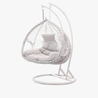 Porch swing with tropical ivory and auburn hydrophobic framed pads, metal stand and chain included