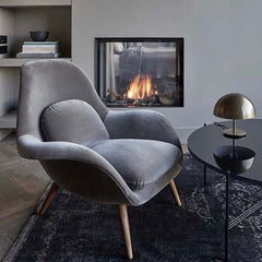 Luxurious Nordic modern single sofa lounge chair with ottomans and velvet fabric cushion for ultimate comfort