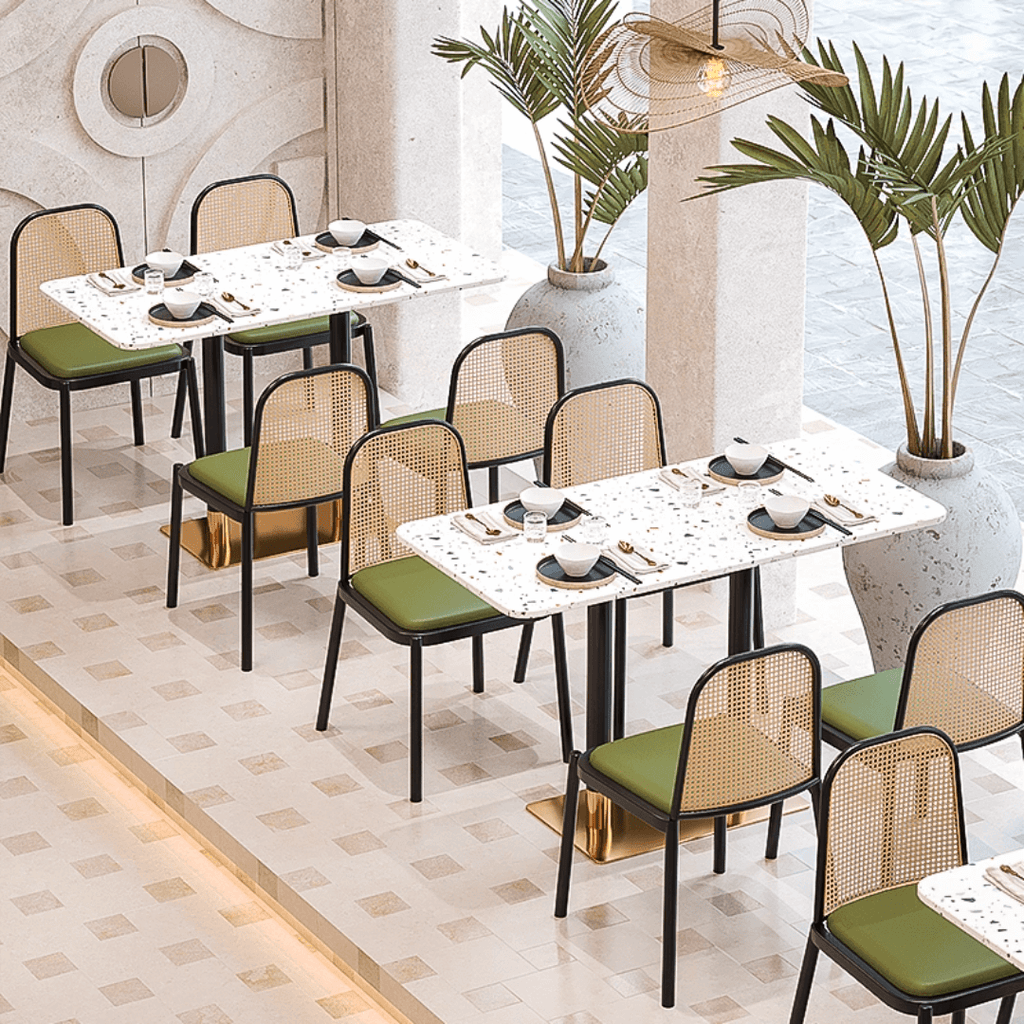 Rattan dining chairs with durable terrazzo table for an elegant dining setup