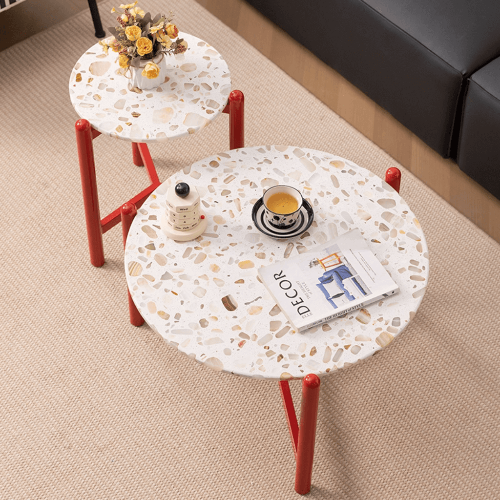 Round side table with vibrant red terrazzo top, featuring a modern minimalist design