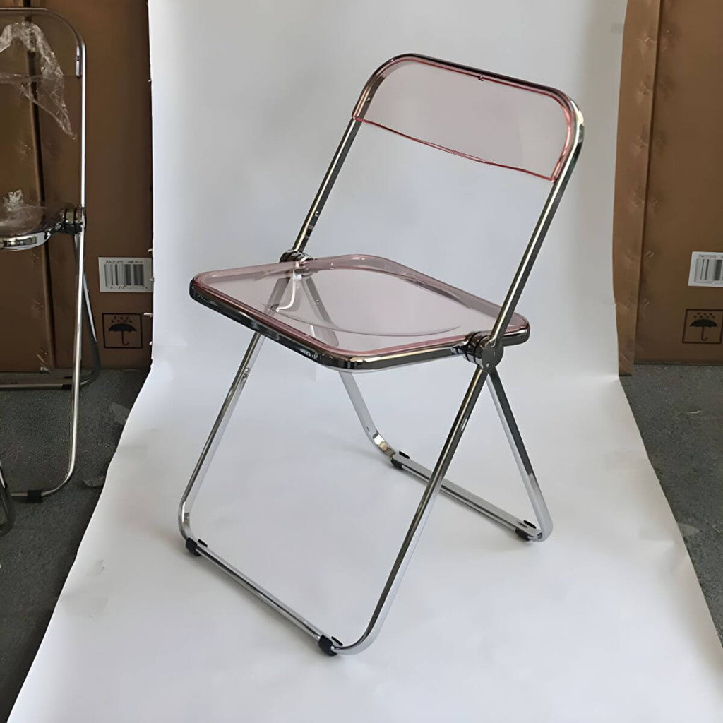 Contemporary acrylic folding armless chair with open back, ideal for dining rooms