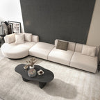 Beige modern L-shaped sectional sofa with pillows and black legs, perfect for corner seating