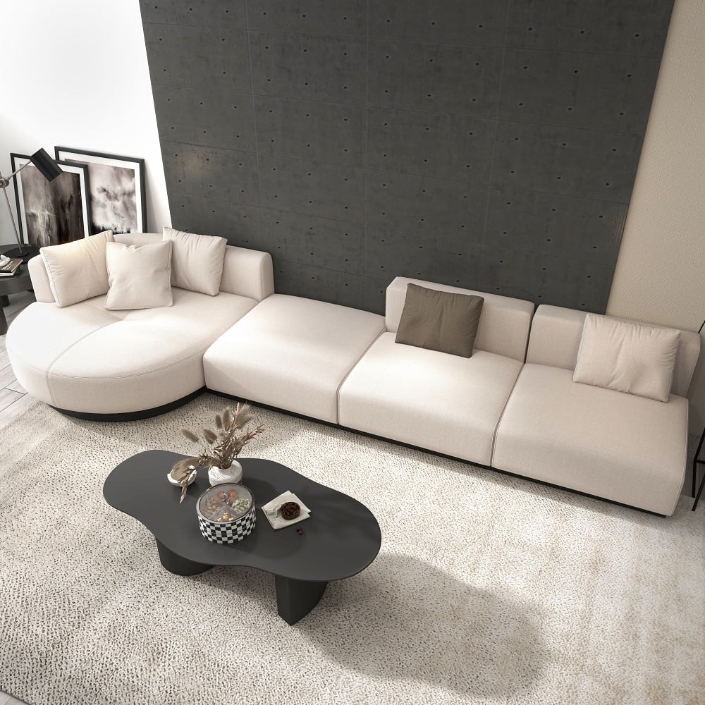 Beige modern L-shaped sectional sofa with pillows and black legs, perfect for corner seating