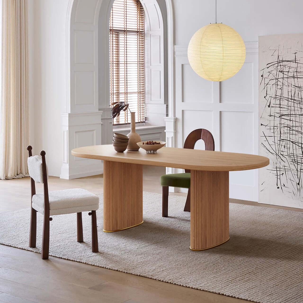 Oval dining table made of solid ash wood with a smooth finish, perfect for modern dining rooms