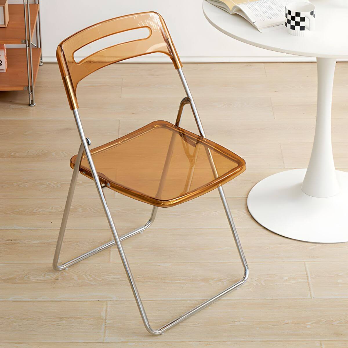 Modern collapsible open back side chair made of plastic and acrylic, ideal for kitchen and dining areas