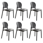 Stackable Scandinavian side chair with open back made of plastic and acrylic for dining