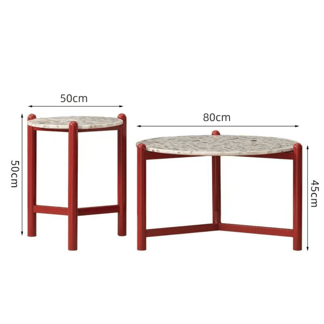 Round side table with vibrant red terrazzo top, featuring a modern minimalist design