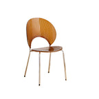 Stackable acrylic dining chair with open back and metal legs, armless design for modern dining rooms