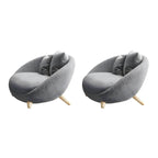 Scandinavian papasan chair with fixed back, sloped arms, cotton blend fabric, and 2 pillows
