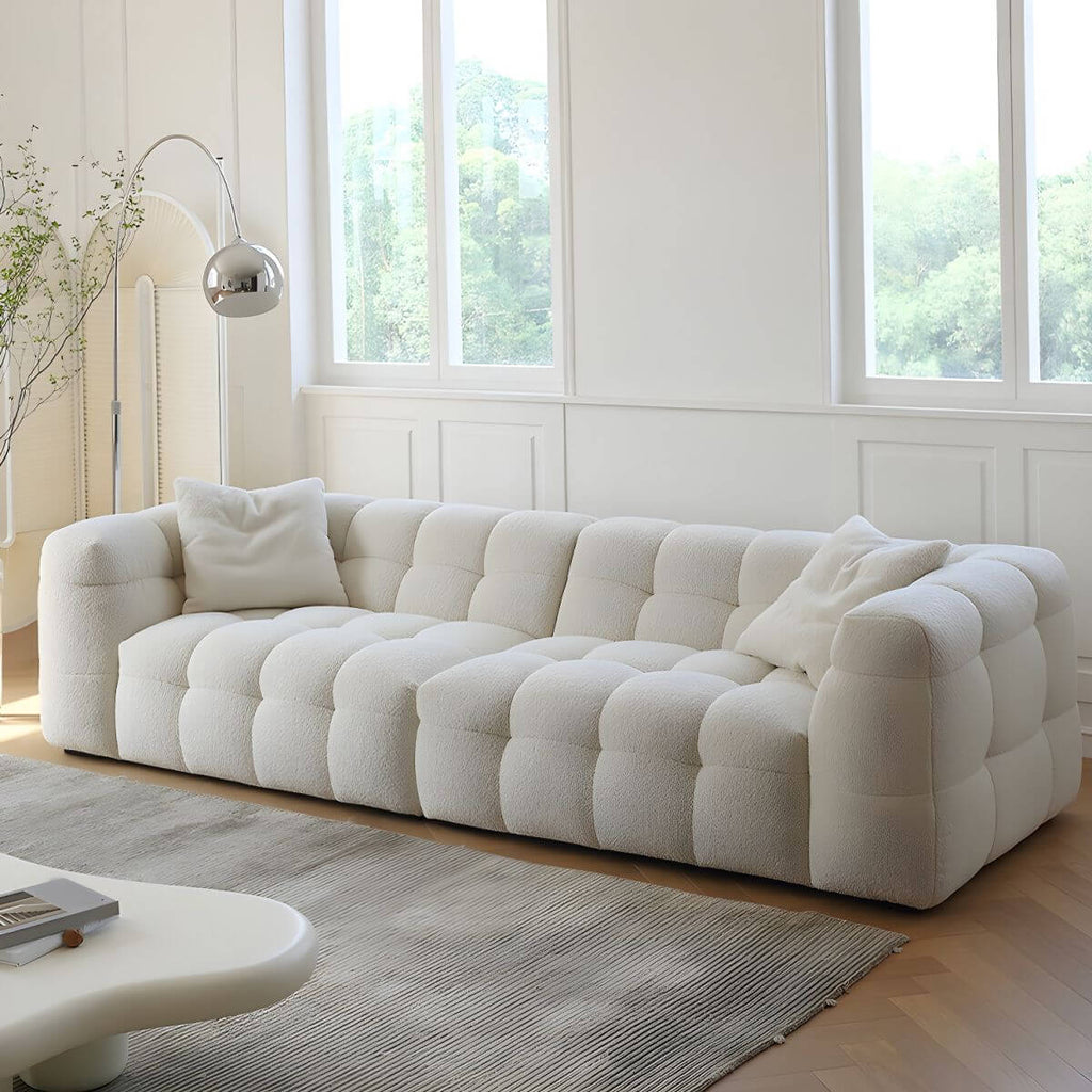 White fabric tuxedo arm sofa with biscuit back, 27.55 inches tall