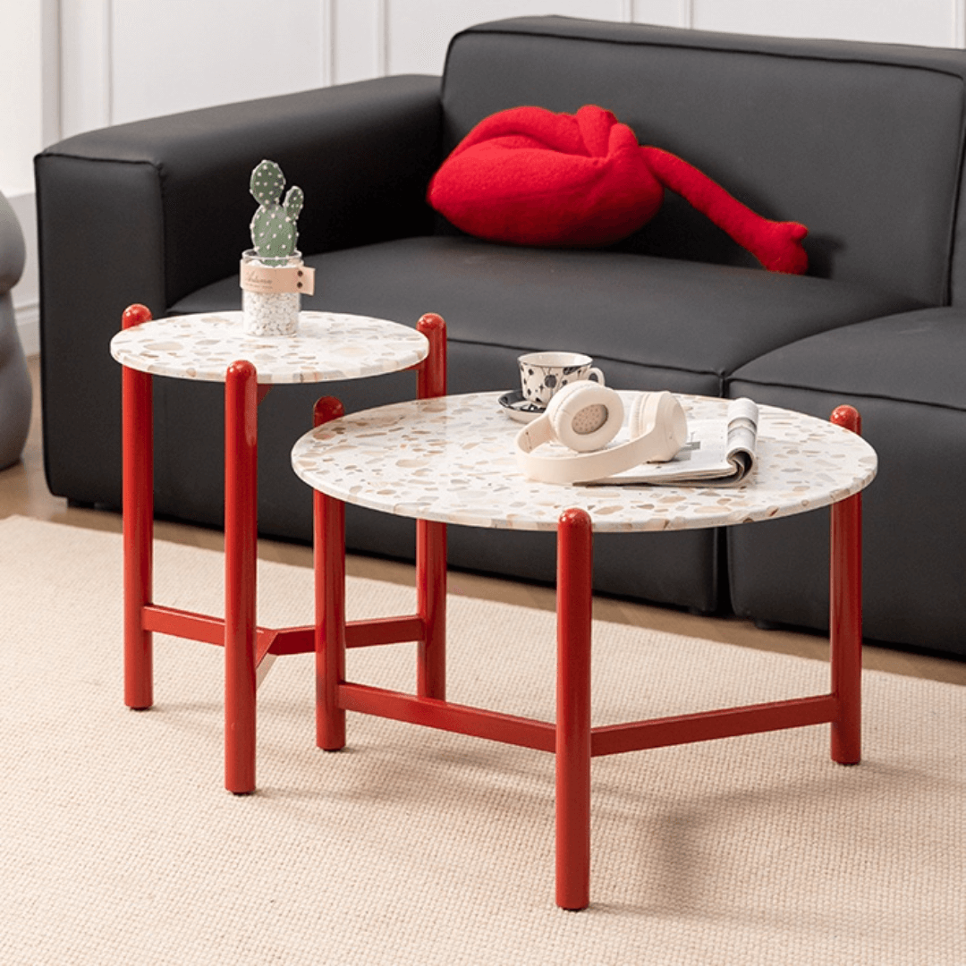 Round side table with vibrant red terrazzo top, featuring a modern minimalist design