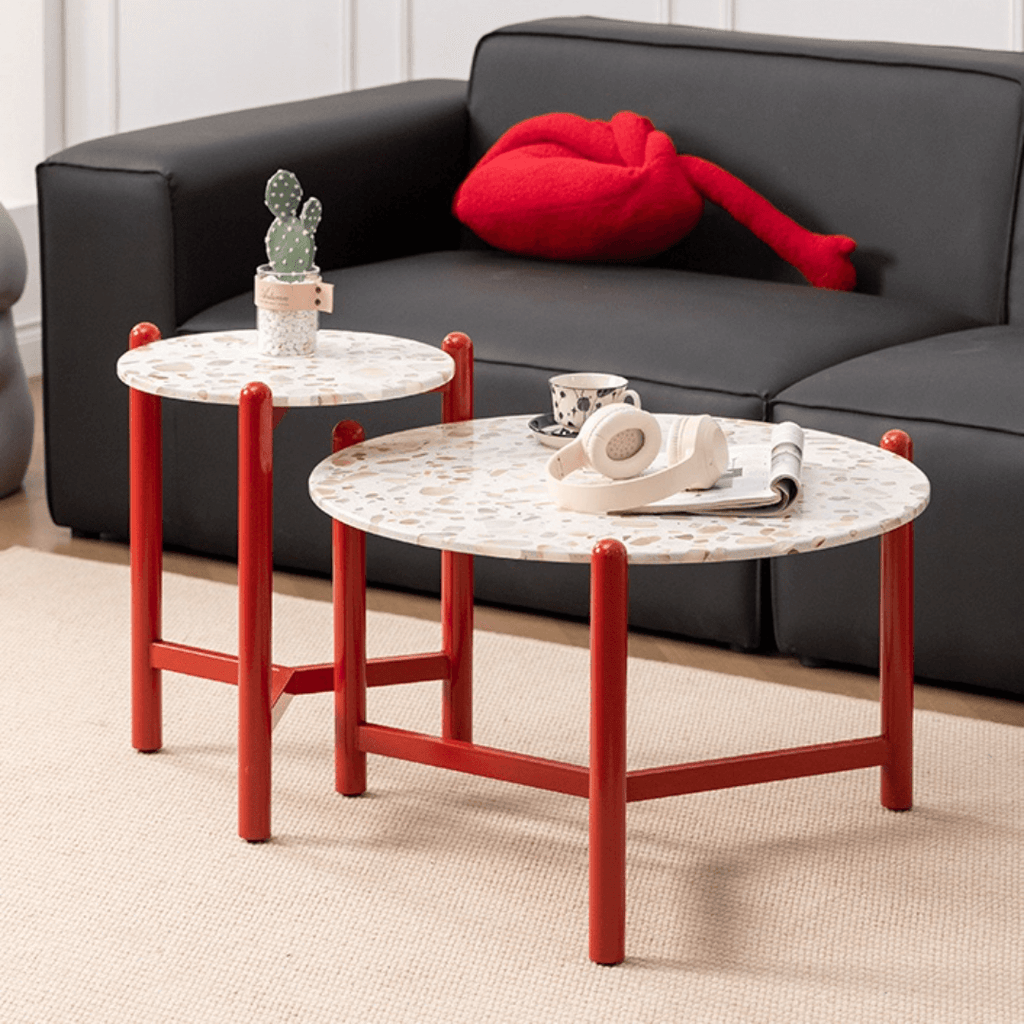 Round side table with vibrant red terrazzo top, featuring a modern minimalist design