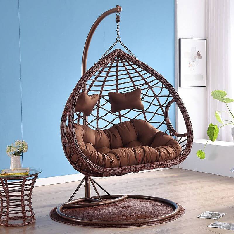 Metal porch swing with cushions, chain, and stand, designed to be heat resistant for outdoor use