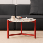 Round side table with vibrant red terrazzo top, featuring a modern minimalist design