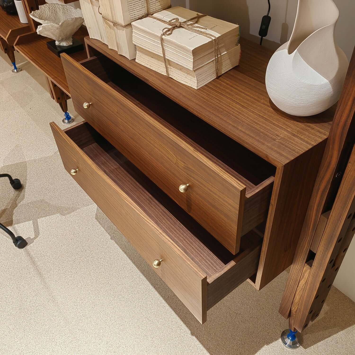 Mid-century modern floor-to-ceiling bookcase with sleek design and ample storage space