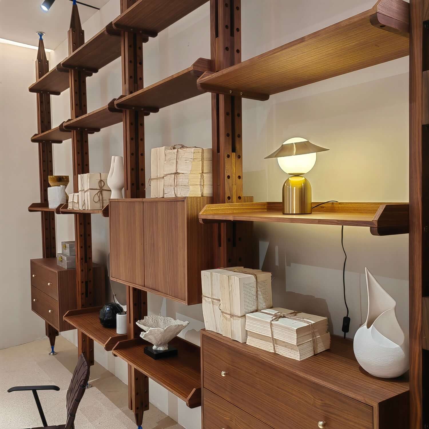 Mid-century modern floor-to-ceiling bookcase with sleek design and ample storage space