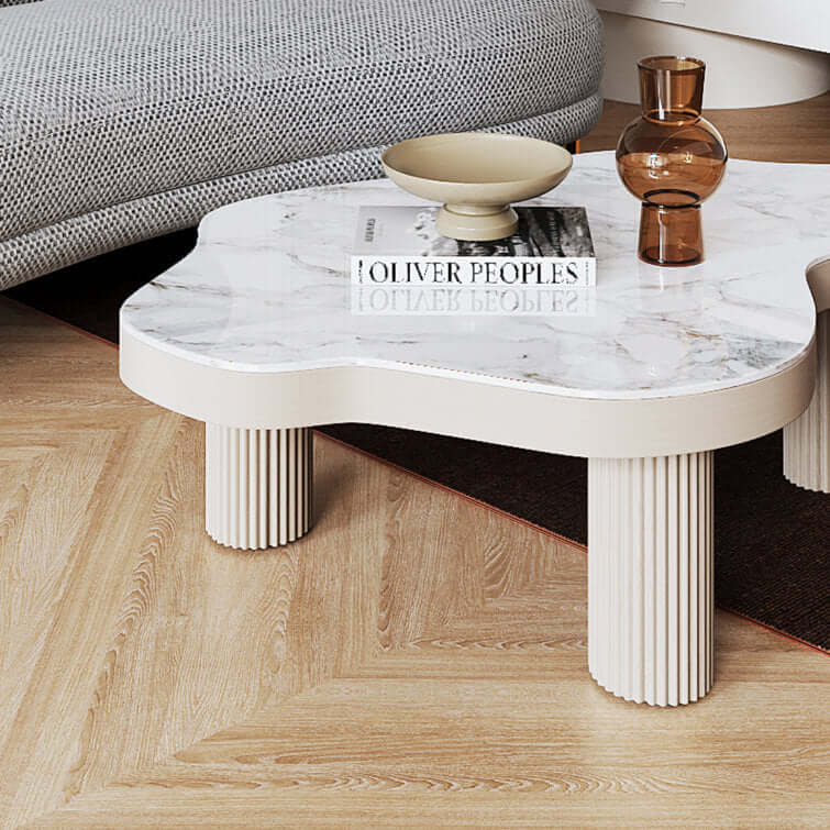 White sintered stone coffee table with three legs, perfect for indoor tea settings
