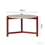 Round side table with vibrant red terrazzo top, featuring a modern minimalist design