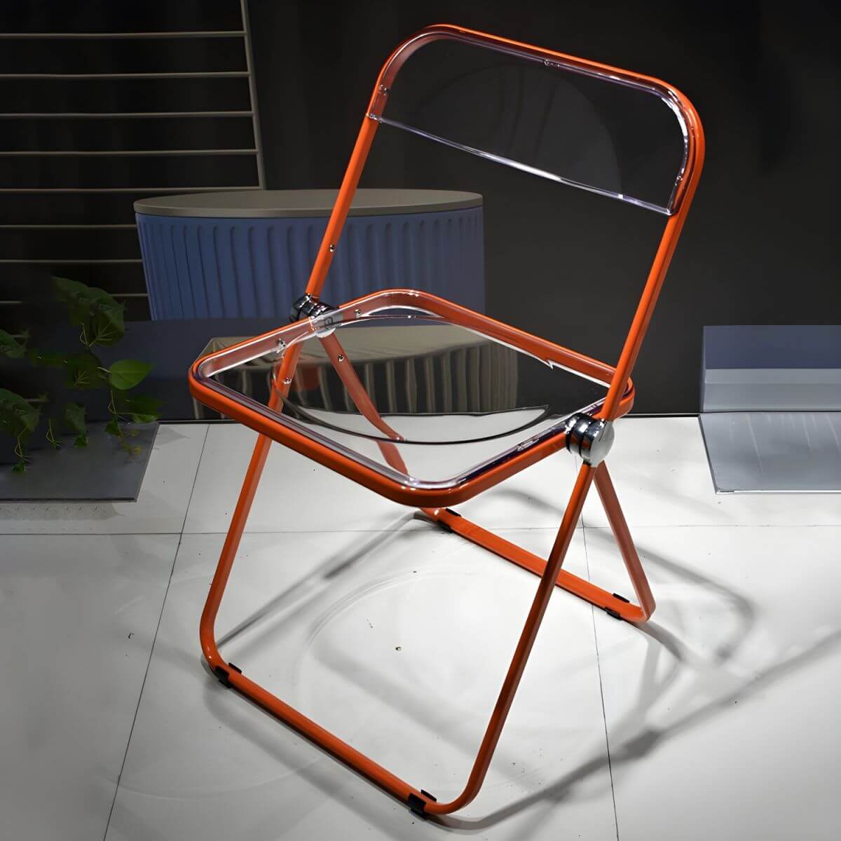 Contemporary acrylic folding armless chair with open back, ideal for dining rooms