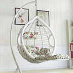 Two-seater metal porch swing egg chair with stand, cushions, and chain included