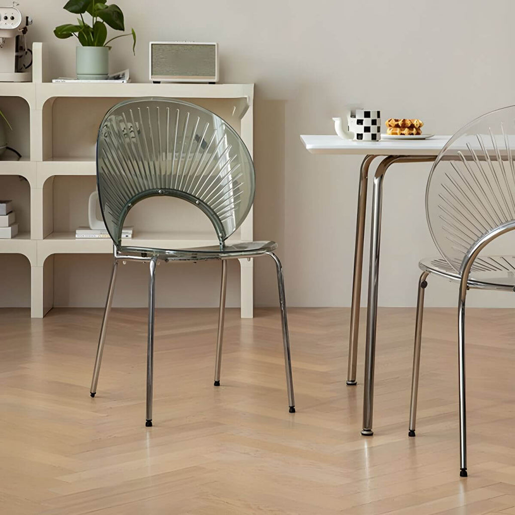 Stackable Scandinavian style dining chair with plastic seat, acrylic back, and silver legs main product image
