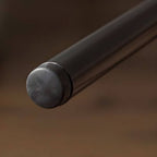 Mid century modern 2-seater sofa with black metal frame and solid wood arms