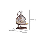 Metal porch swing with cushions, chain, and stand, designed to be heat resistant for outdoor use