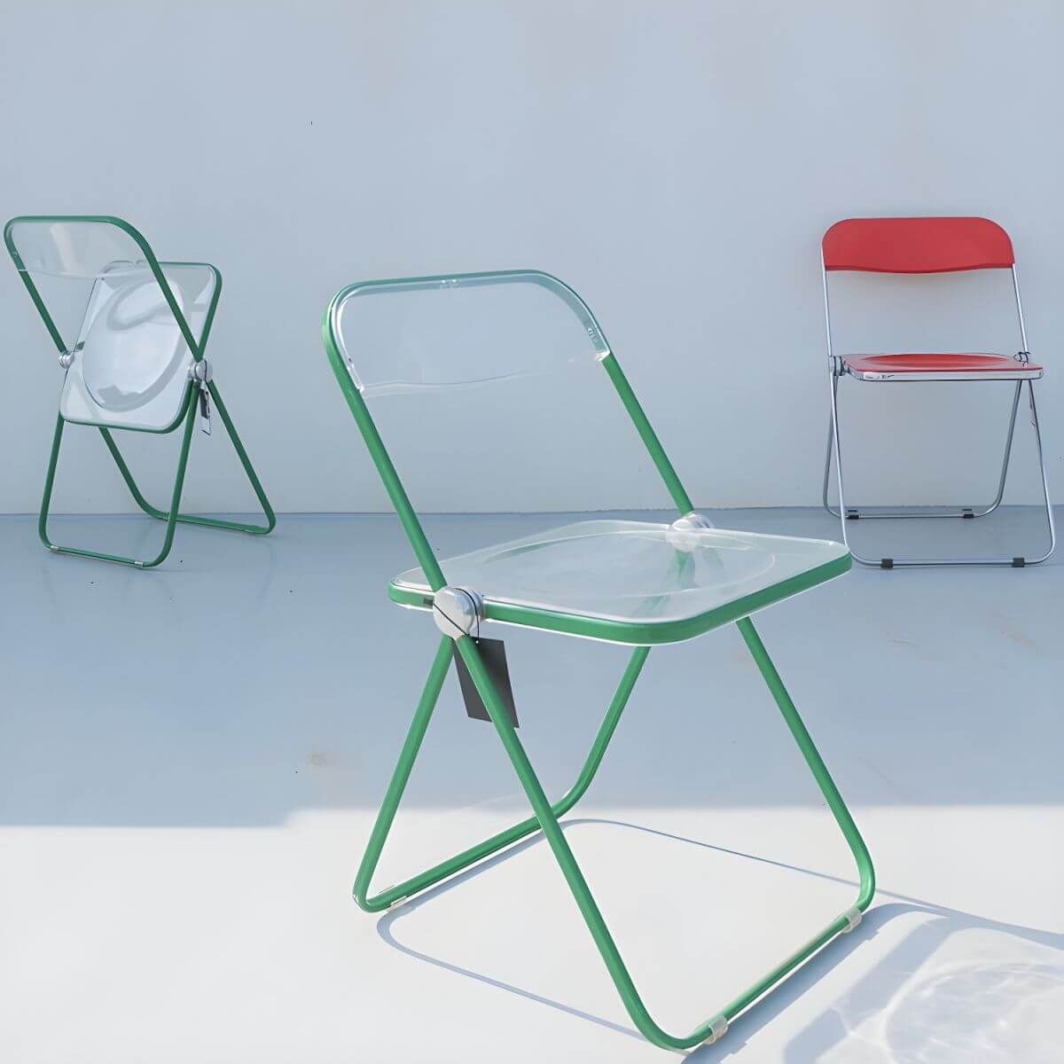 Contemporary acrylic folding armless chair with open back, ideal for dining rooms