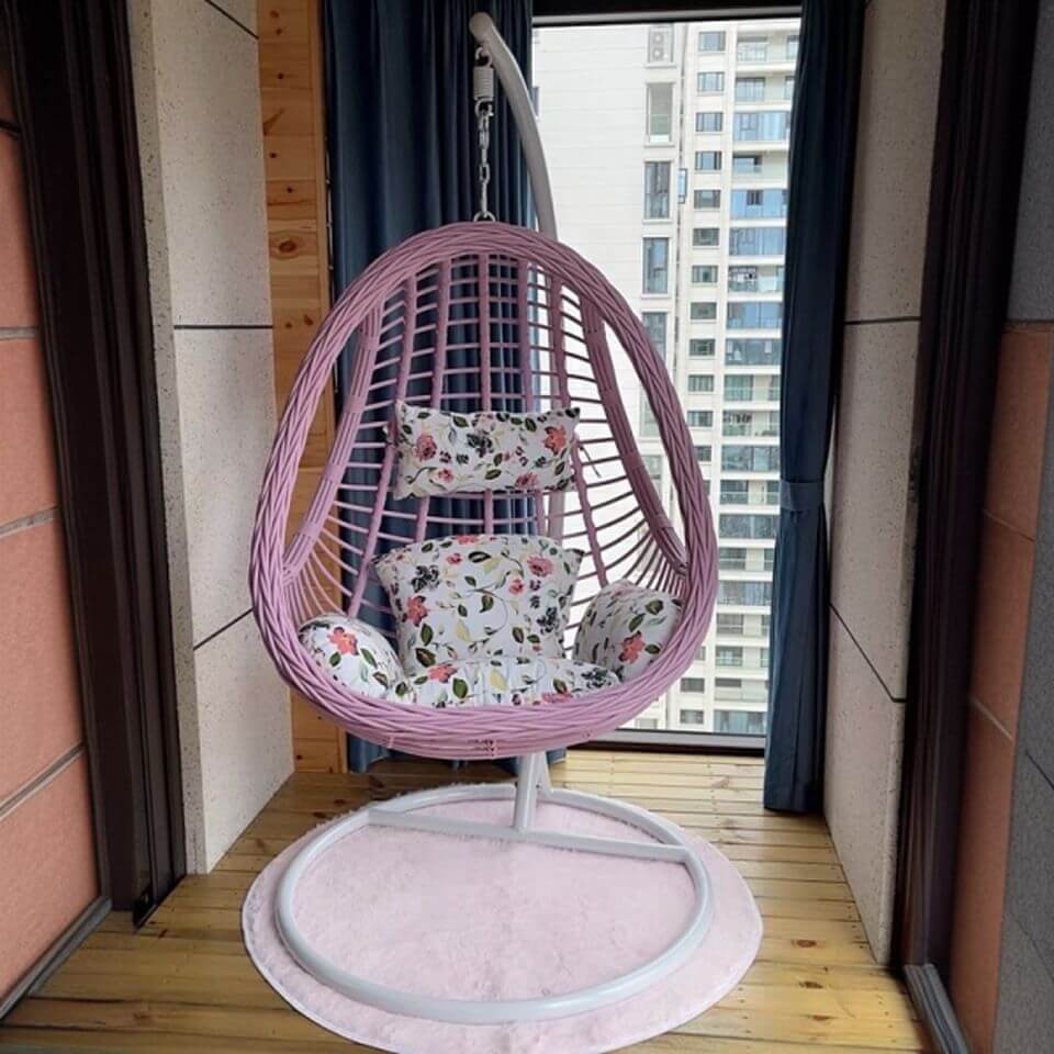 Tropical upholstered porch swing with metal chain and included stand for outdoor relaxation