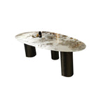 Oval marble dining table with white top and three gold steel legs