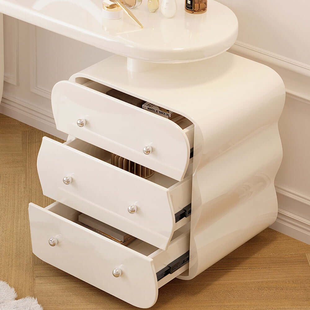 White makeup vanity featuring an adjustable side cabinet with three drawers for storage