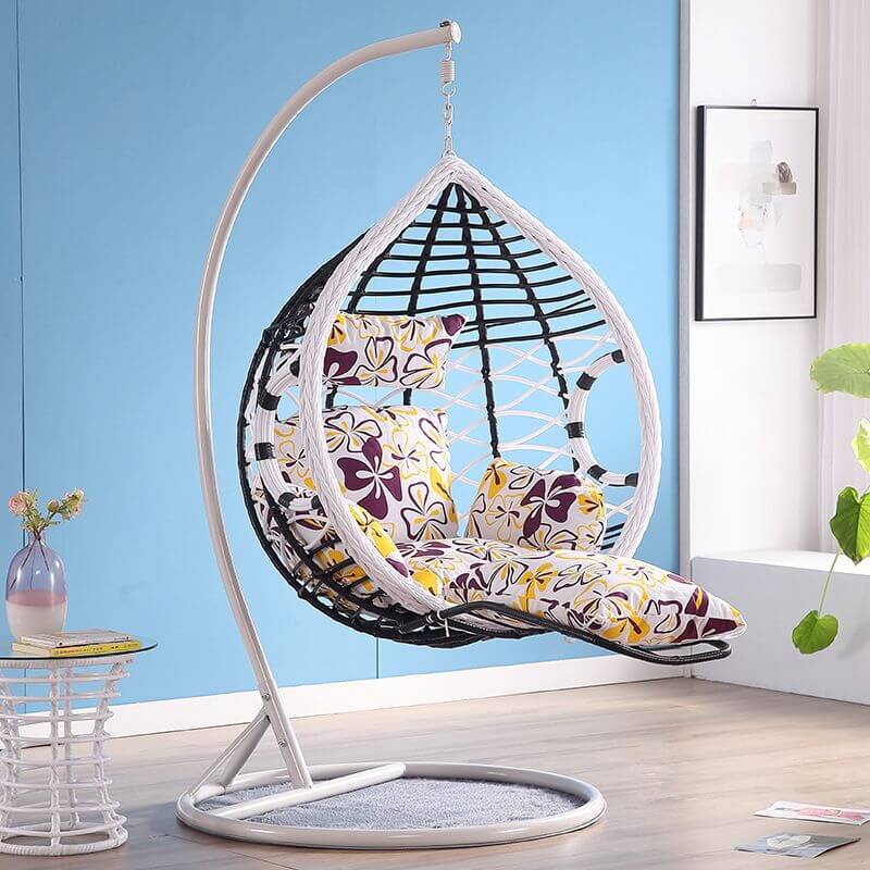 Metal porch swing with cushions, chain, and stand, designed to be heat resistant for outdoor use