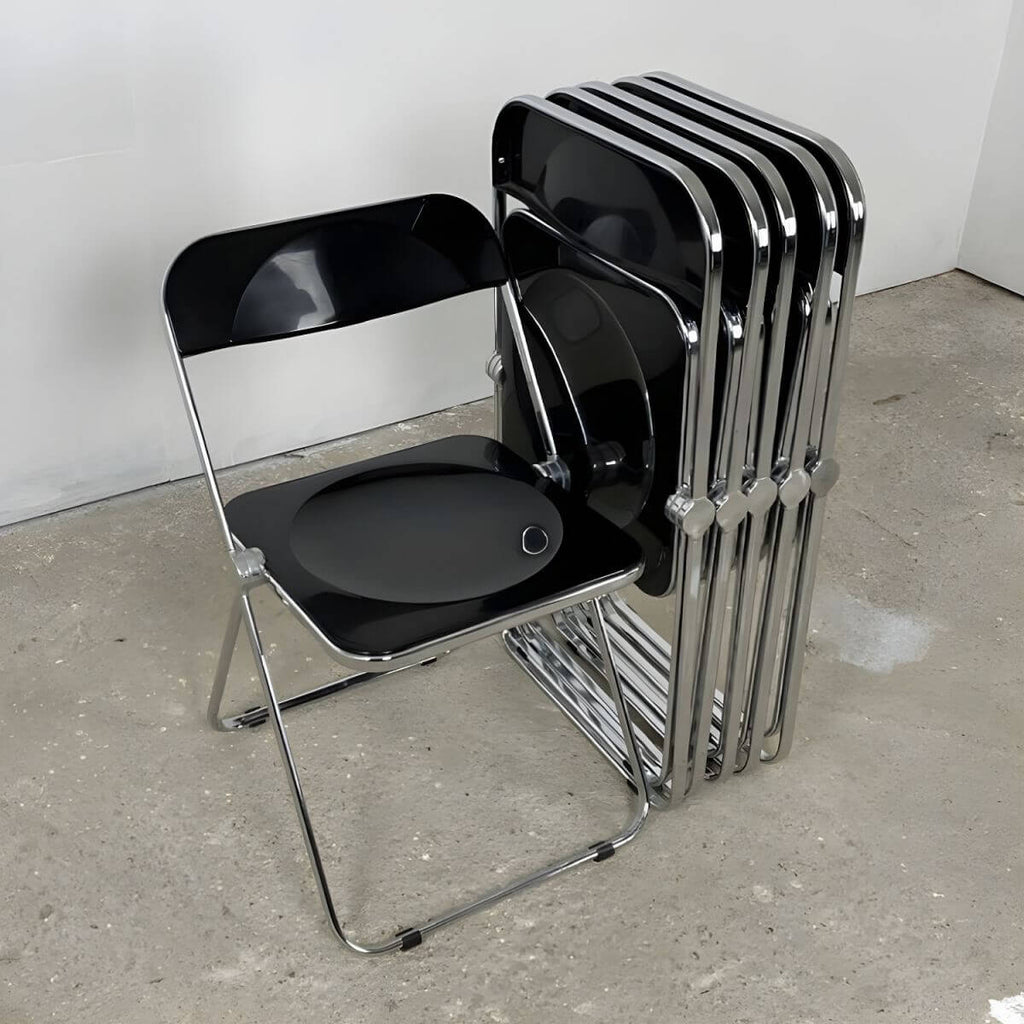 Contemporary acrylic folding armless chair with open back, ideal for dining rooms