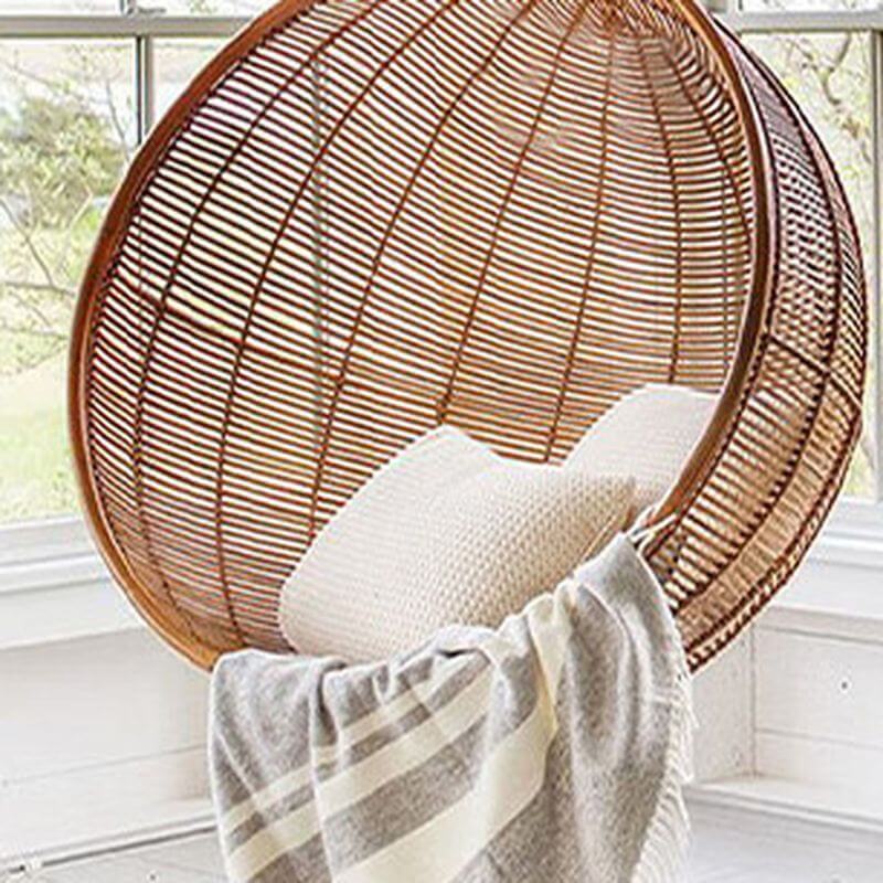 Climate-resistant metal porch swing with cushions, chain, and stand in unfinished color