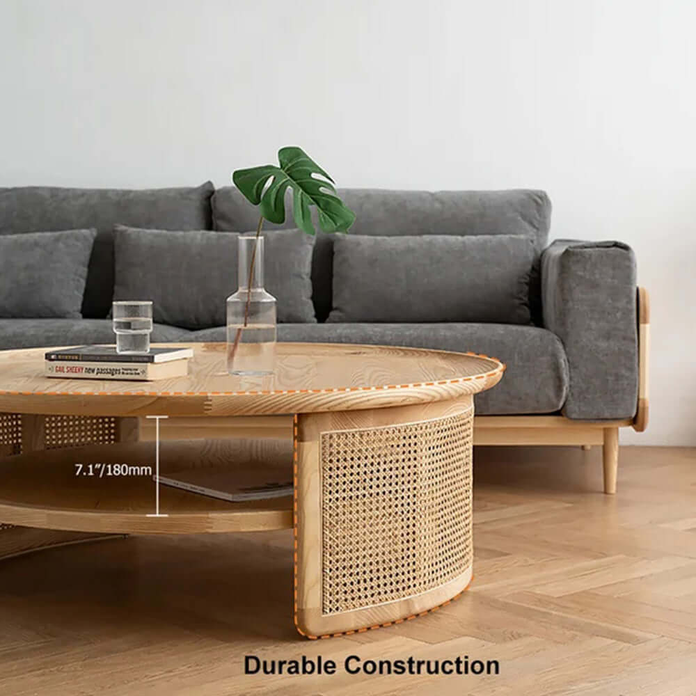 Round Japandi coffee table with solid wood top and rattan base, featuring two tiers for storage