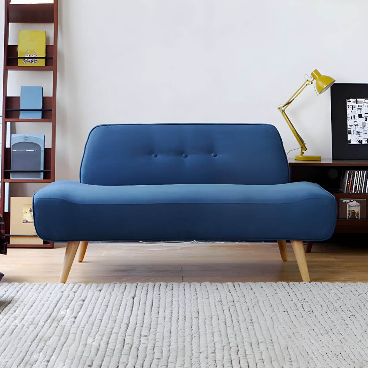 Small Scandinavian style sofa with wood frame and solid color polyester upholstery