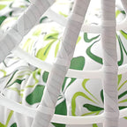 Two-seater metal porch swing egg chair with stand, cushions, and chain included