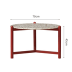 Round side table with vibrant red terrazzo top, featuring a modern minimalist design
